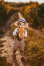 a boy in a field of sunflowers eats wheat bread Royalty Free Stock Photo