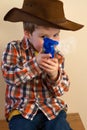 Boy firing cap gun Royalty Free Stock Photo