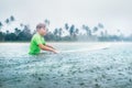 Boy first step surfer learning to surf under the rain Royalty Free Stock Photo