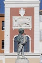 Boy with Fish fountain on Marshal Tito Square in front of Tower with city clock, Rovinj, Croatia Royalty Free Stock Photo