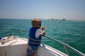 Boy fishing on boat Royalty Free Stock Photo