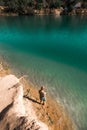 Boy fishing from dock on lake. Kid fishing in clean blue lake in wild nature. Royalty Free Stock Photo