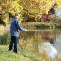 Boy fishing on pond Royalty Free Stock Photo