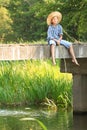 Boy during fishing with rod on bridge Royalty Free Stock Photo