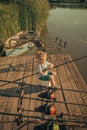 Boy with fishing rod catching fish in the summer Royalty Free Stock Photo