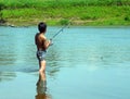 Boy fishing with spinning Royalty Free Stock Photo