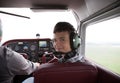 Boy fliyng in the plane cabin