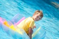 Boy on float swimming pool Royalty Free Stock Photo