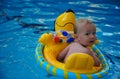 Boy floating in a swimming pool v2.0