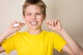 Boy flossing teeth. Close-up portrait of teen boy with dental fl Royalty Free Stock Photo