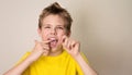 Boy flossing teeth. Close-up portrait of teen boy with dental fl Royalty Free Stock Photo