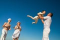 Boy flying on his father's hands