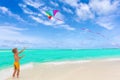 Boy flying kite on beach Royalty Free Stock Photo