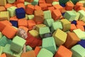 Boy is fooling around in childrens playroom. Soft cubes for games. Child is having fun in an entertainment center