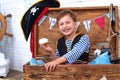 Boy in the form of pirates at helm. holiday decoration pirate style