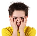 Boy with frightened look in white background Royalty Free Stock Photo