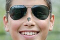 Boy with frog on nose Royalty Free Stock Photo