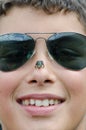 Boy with frog on nose Royalty Free Stock Photo