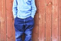 Boy in front of fence Royalty Free Stock Photo