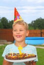 Boy with fruit pie, happy birthday party Royalty Free Stock Photo