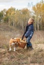 Boy with full heavy basket of mushrooms on the forest glade Royalty Free Stock Photo