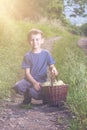 Boy with full herbs flower basket on way