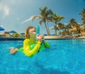 boy fun jumping into the swimming pool, shot through the underwater package Royalty Free Stock Photo