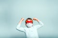 A boy with a fun superhero mask to protect himself from the viral infections of the disease