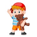 A boy funny play with the teddy bear