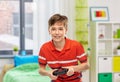 boy with gamepad playing video game at home Royalty Free Stock Photo