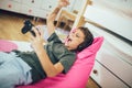 Boy with gamepad playing video game at home Royalty Free Stock Photo