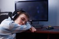 Boy gamer sleeps near computer, tired of playing. Computer, onli Royalty Free Stock Photo