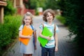 Boy and gerl on the way to school. Royalty Free Stock Photo