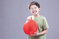 Boy gets air blast from balloon. Royalty Free Stock Photo