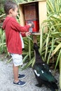 Boy gets seeds to feed musovy duck