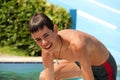 Boy getting out of swimming pool Royalty Free Stock Photo