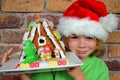 Boy and gingerbread house