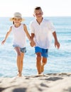 Boy and girl actively jogging together