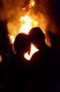 The boy and girl on the background of fire (love, relationships, Royalty Free Stock Photo