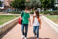 Boy and girl with backpacks and masks going to school in coronavirus pandemic Royalty Free Stock Photo