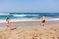 Boy Girl Beach Ocean Bat Ball Playtime Royalty Free Stock Photo