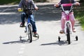 Boy and girl on bicycles. Royalty Free Stock Photo