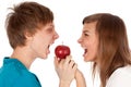 Boy and a girl biting the apple Royalty Free Stock Photo