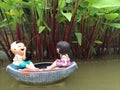 Boy and girl on the boat are smiling with happiness.