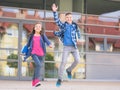 Boy and girl with books and backpacks Royalty Free Stock Photo