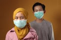 Boy and girl, brother and sister wearing medical mask to prevent covid coronavirus infection, social distancing