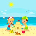 Boy and girl build sand castle