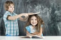 Boy and girl children indulge in school Royalty Free Stock Photo