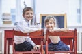 Boy, girl children in the school has a happy, curious, smart Royalty Free Stock Photo