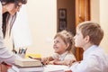 Boy and girl children with the teacher in the school has a happy Royalty Free Stock Photo